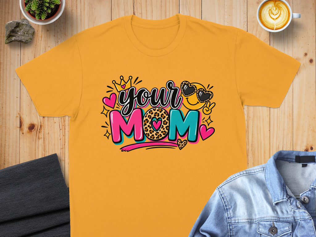 Orange t-shirt with "your MOM" graphic featuring a smiley face with heart sunglasses.
