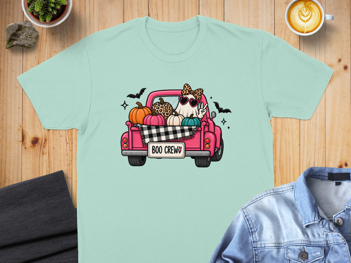 Ghost in sunglasses with bow, peace sign, and pumpkins in a pink truck saying "Boo Crew".