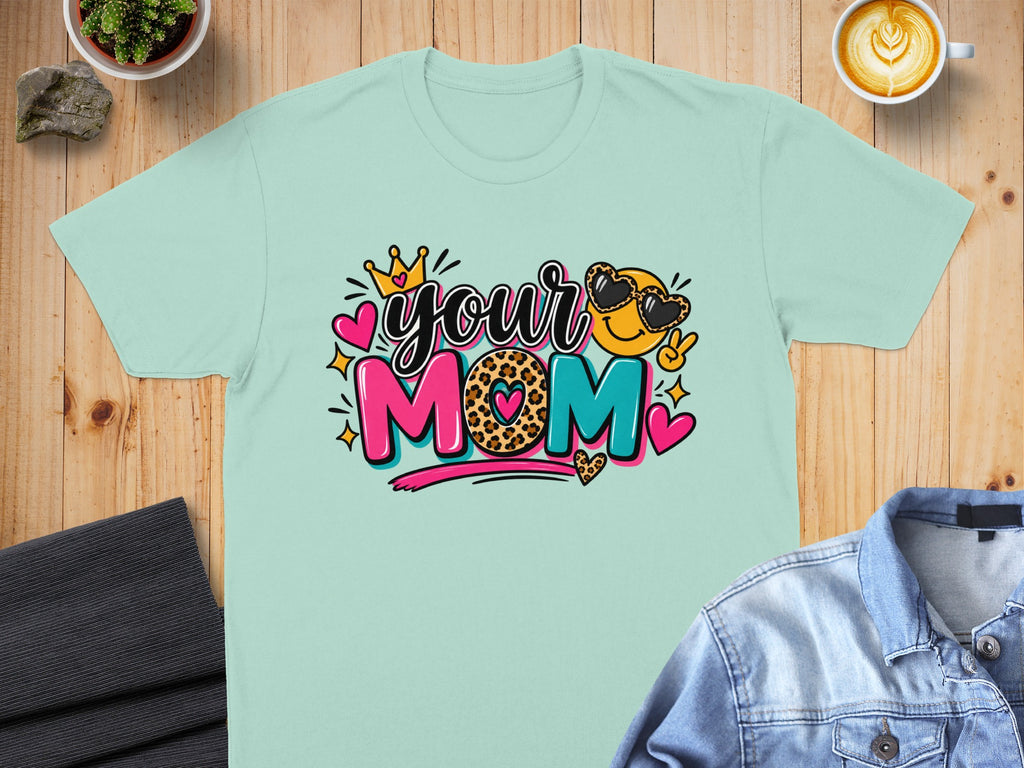 Mint t-shirt with "your MOM" text, crown, leopard print heart, and emoji with heart sunglasses.