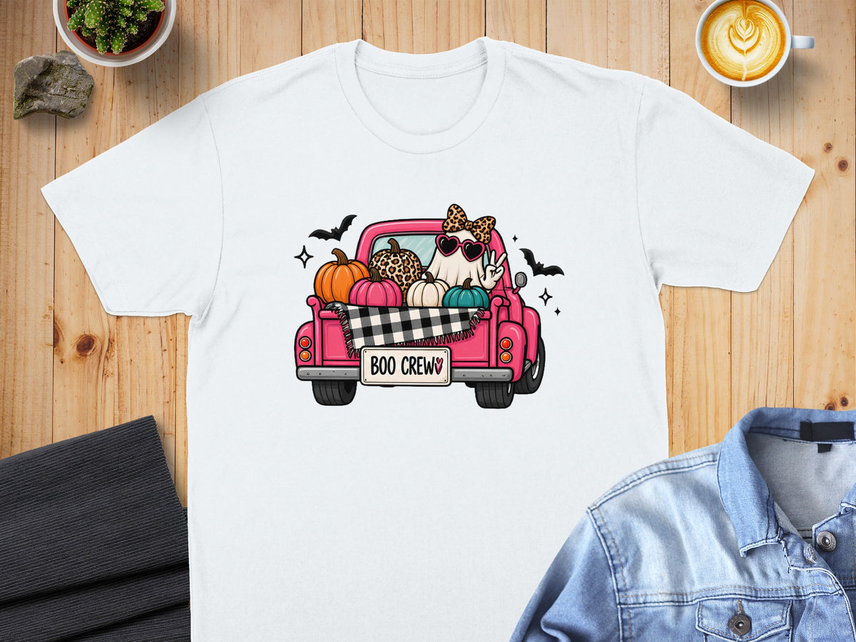 White t-shirt with a pink truck graphic featuring a ghost and pumpkins.